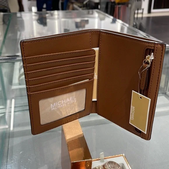 Michael Kors Jet Set Travel Passport Wallet
Brown Signature/Golden-Tone Hardware - Picture 16 of 16